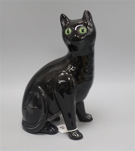 A Bretby ceramic black cat with glass eyes height 34cm